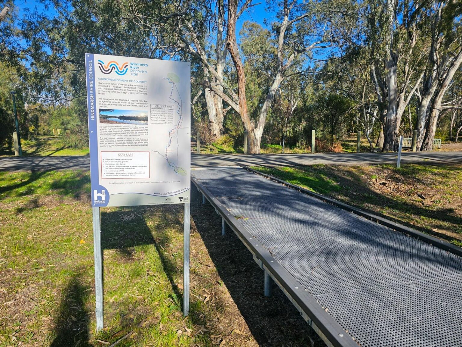 boardwalk with trail sign