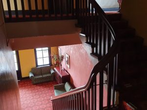 Grand staircase going from foyer to accommodation level