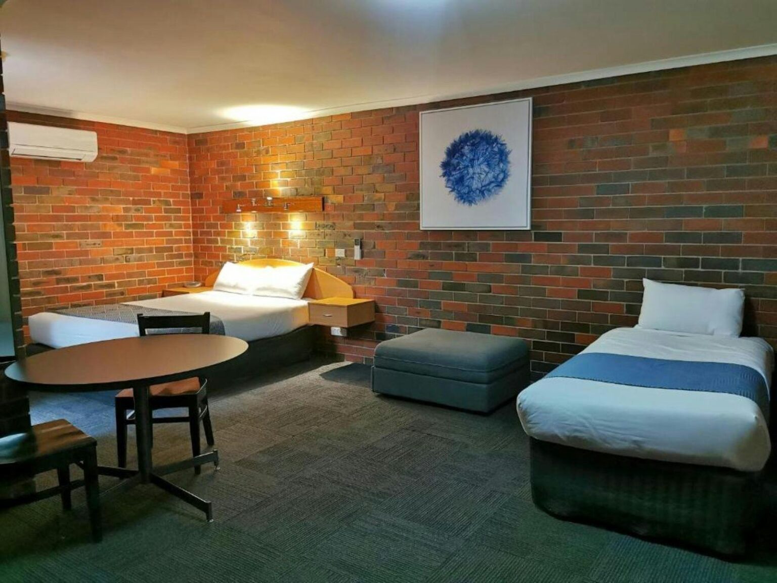 Two beds in a motel style room