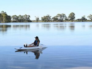 Person canoeing on a large lake