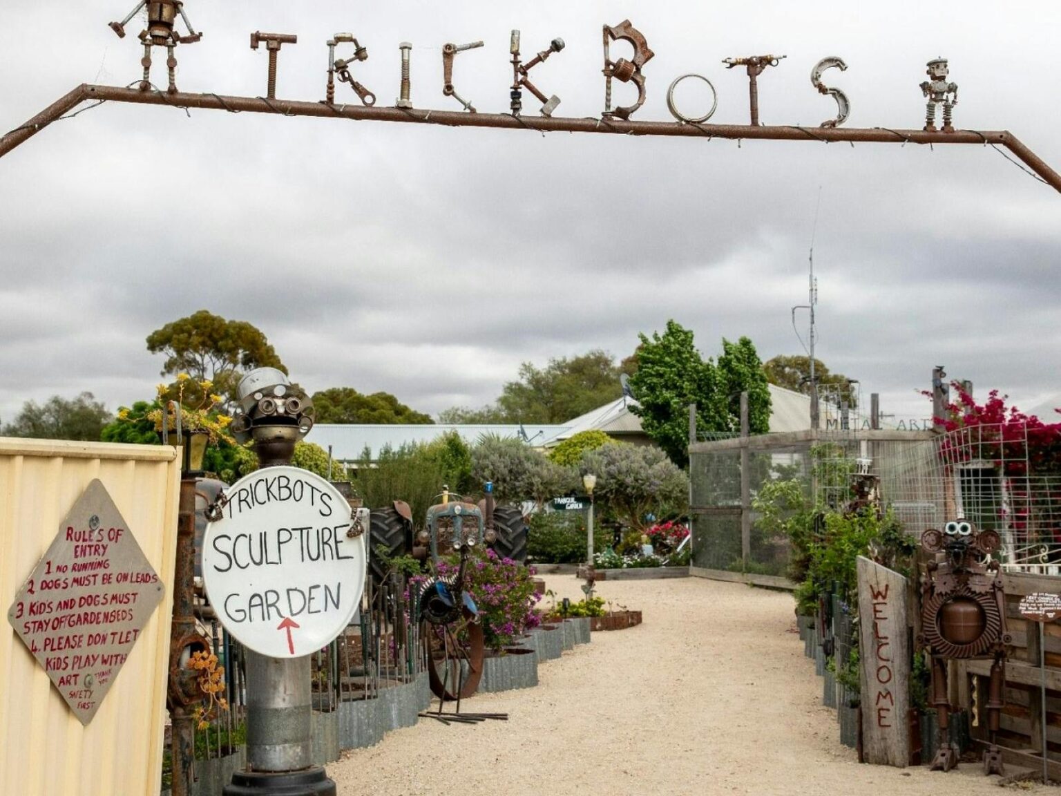 Entrance to a sculpture garden with the word trickbots overhead