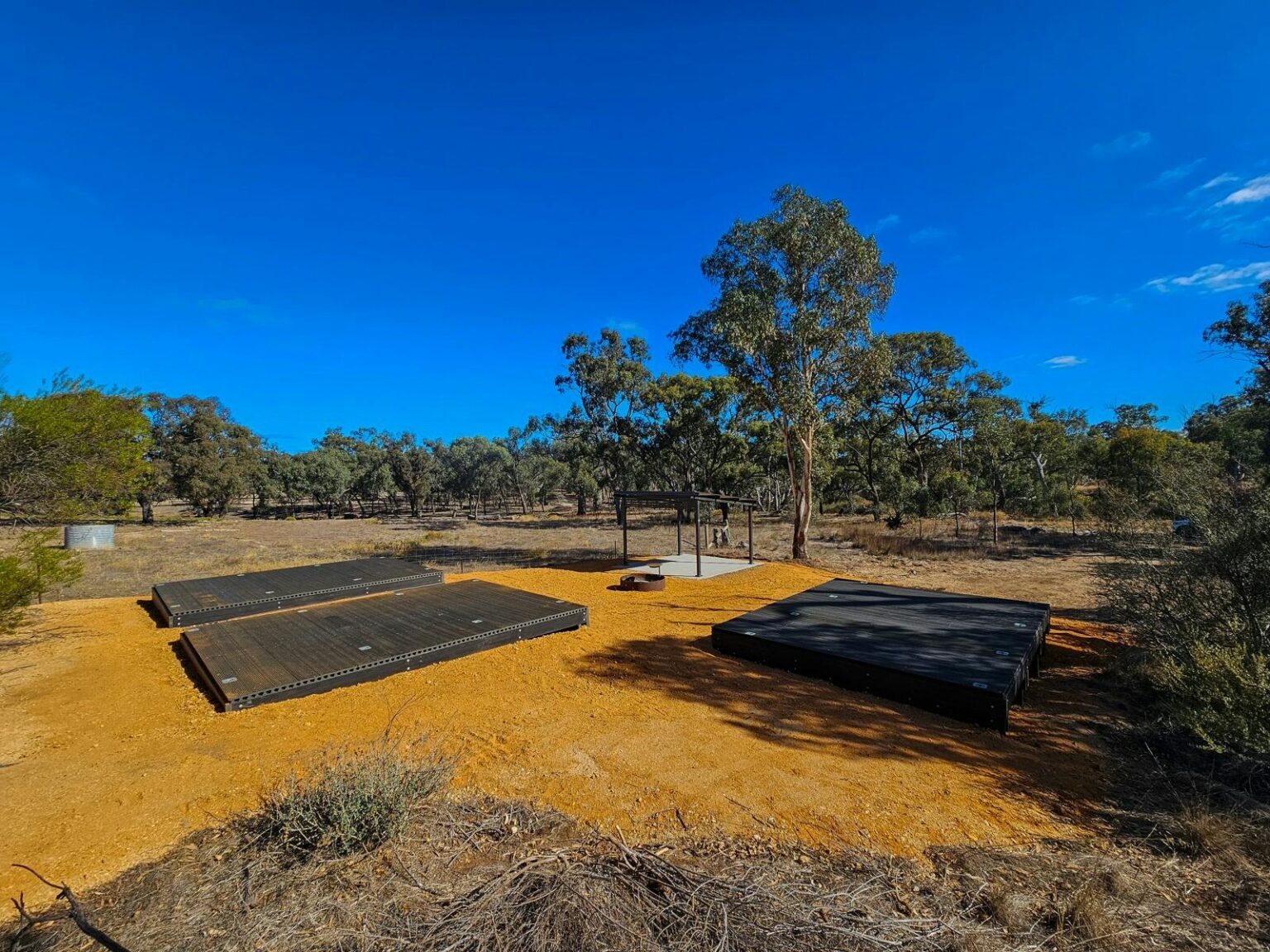 camping area with tent platforms and shelter