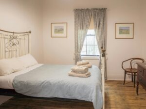 Old fashioned brass bed in a old style hotel room