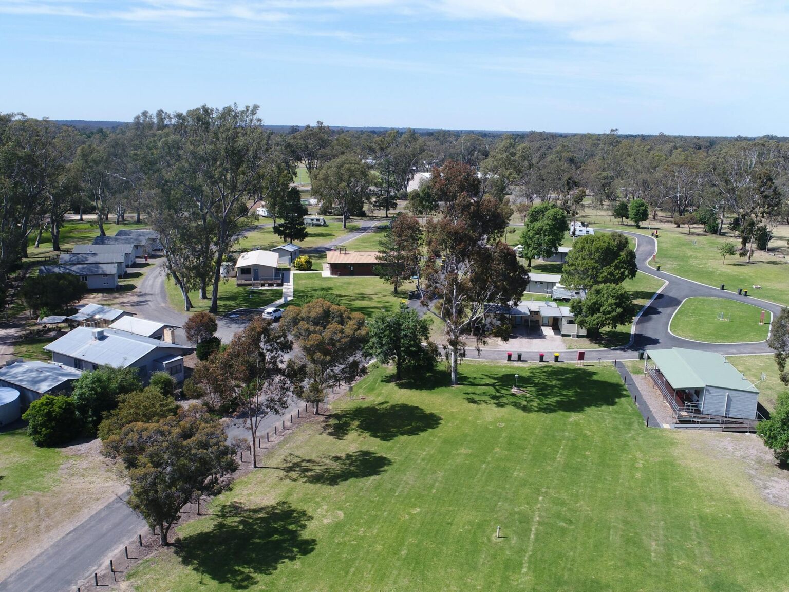 Overhead image of caravan park showing lawn areas