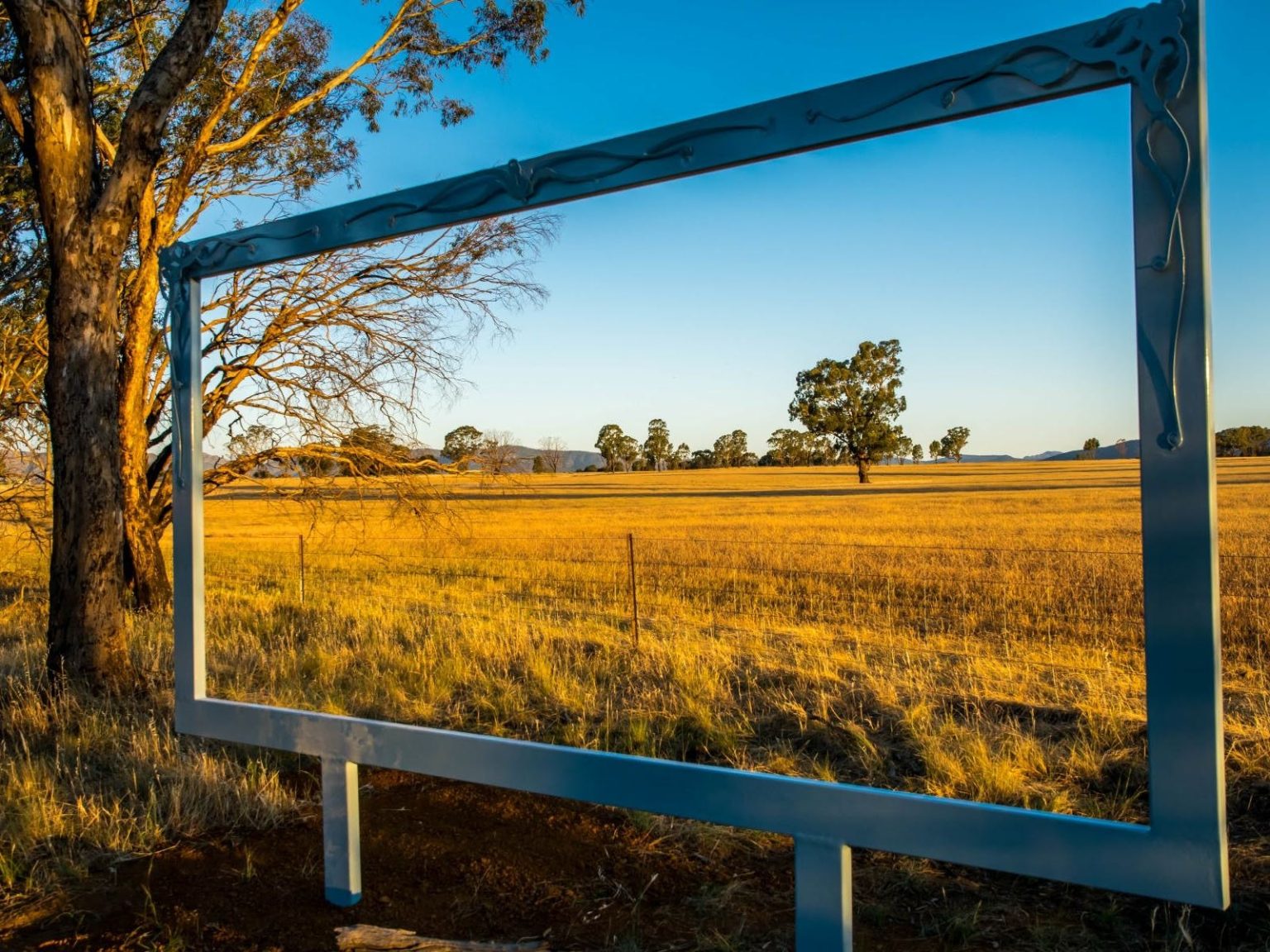 A large outdoor frame which frames the view of a field in the Wimmera Mallee region. Used on Blog page of website