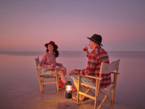 Two people sitting on chairs on Lake Tyrrell (Pink Lake) at Sea Lake Victoria.