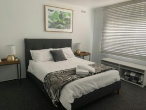 A full shot of the motel. A grey