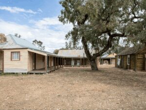 old weatherboard homestead with out buildings