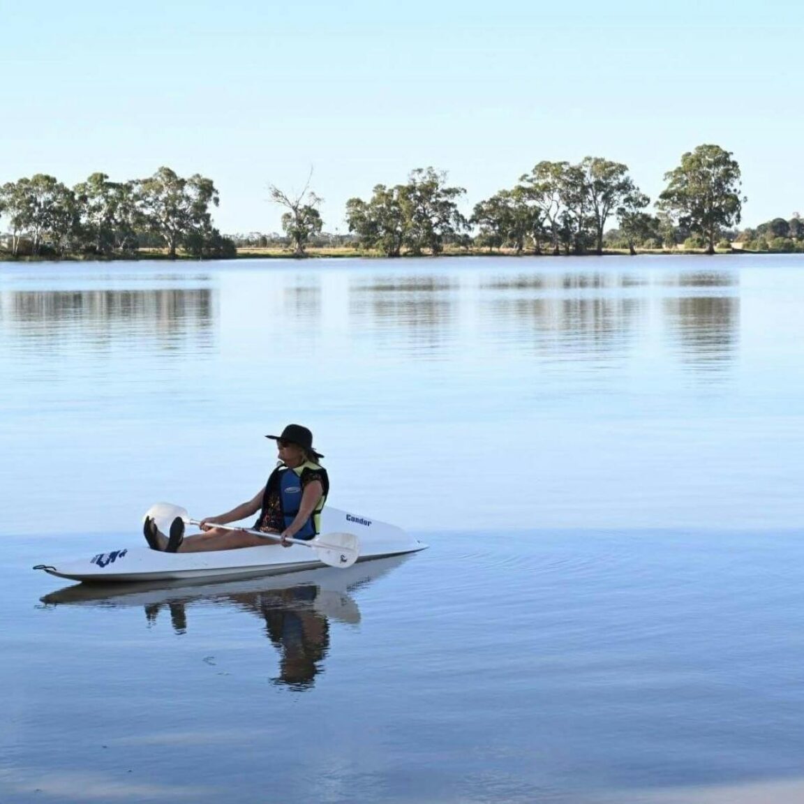 Person canoeing on a large lake