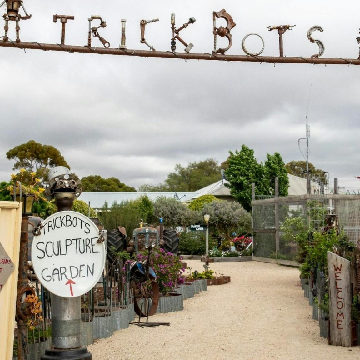 Entrance to a sculpture garden with the word trickbots overhead