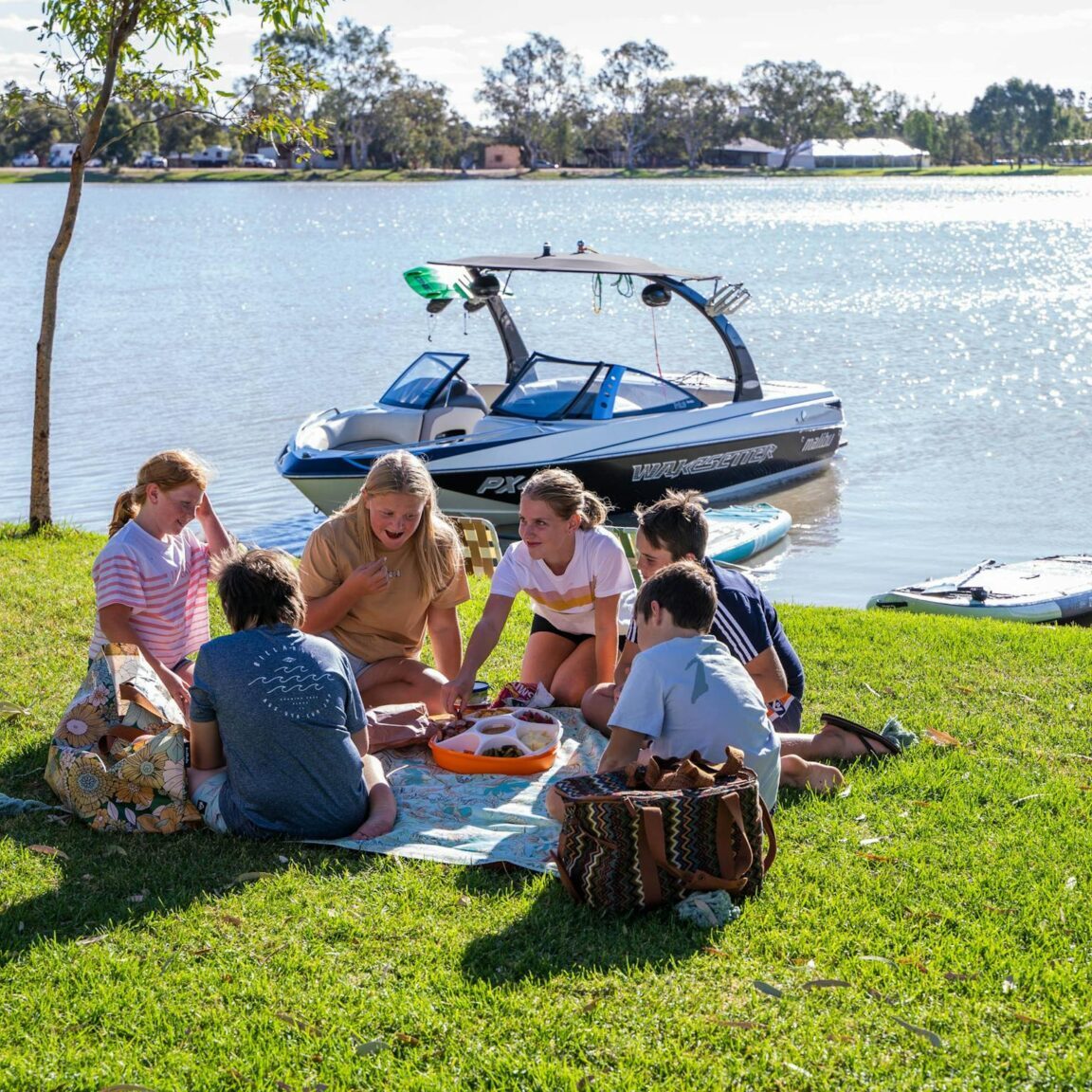 Picnic at the Lake with boat behind
