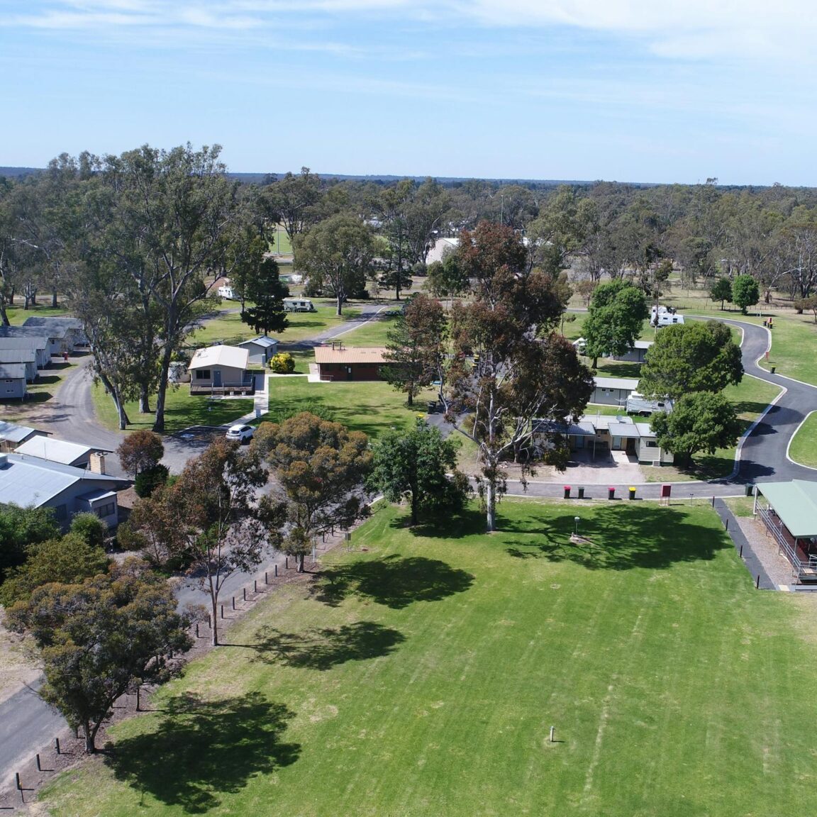 Overhead image of caravan park showing lawn areas