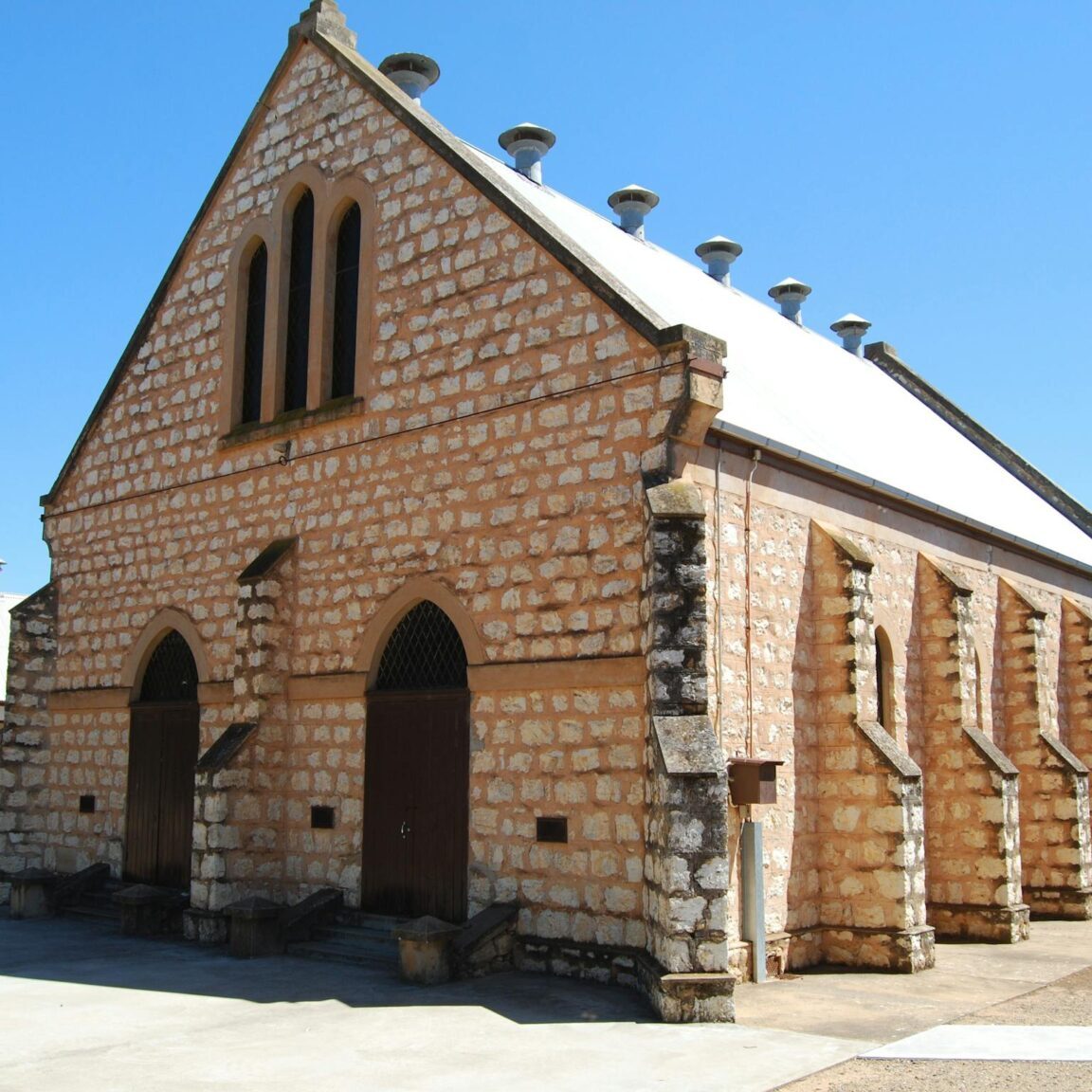 External photo of limestone church