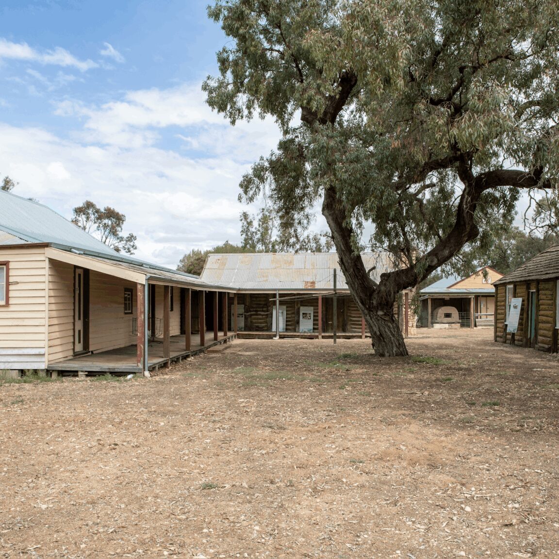 old weatherboard homestead with out buildings