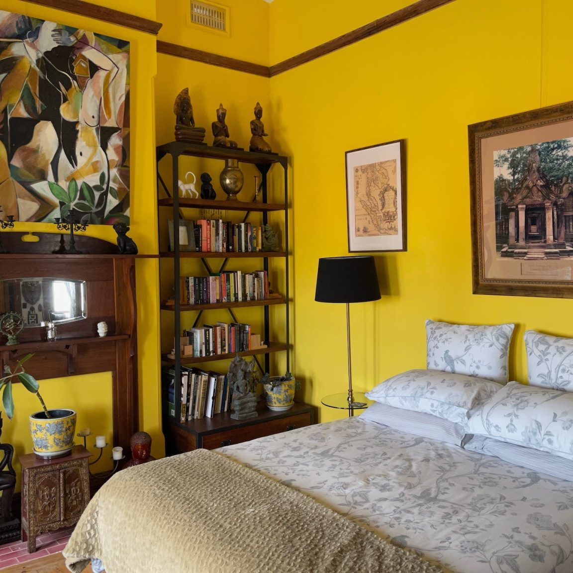 Yellow room with Cambodian pictures and artefacts..
