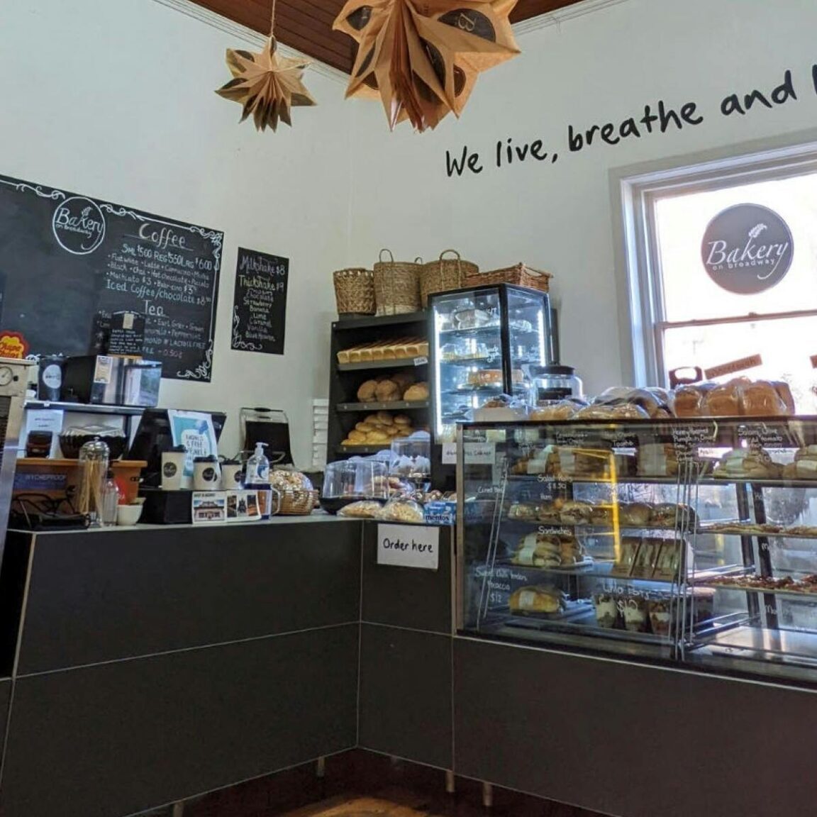 Photo of the interior of a bakery with cabinets of food on display