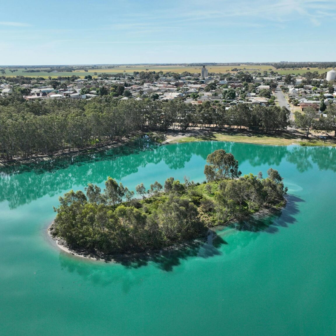 Lake with island and town in background