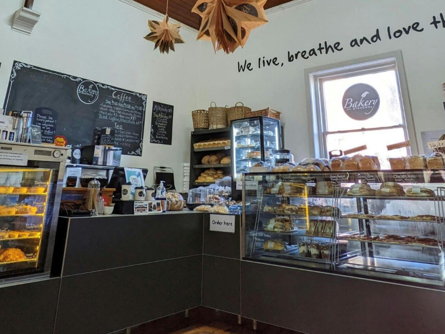 Photo of the interior of a bakery with cabinets of food on display