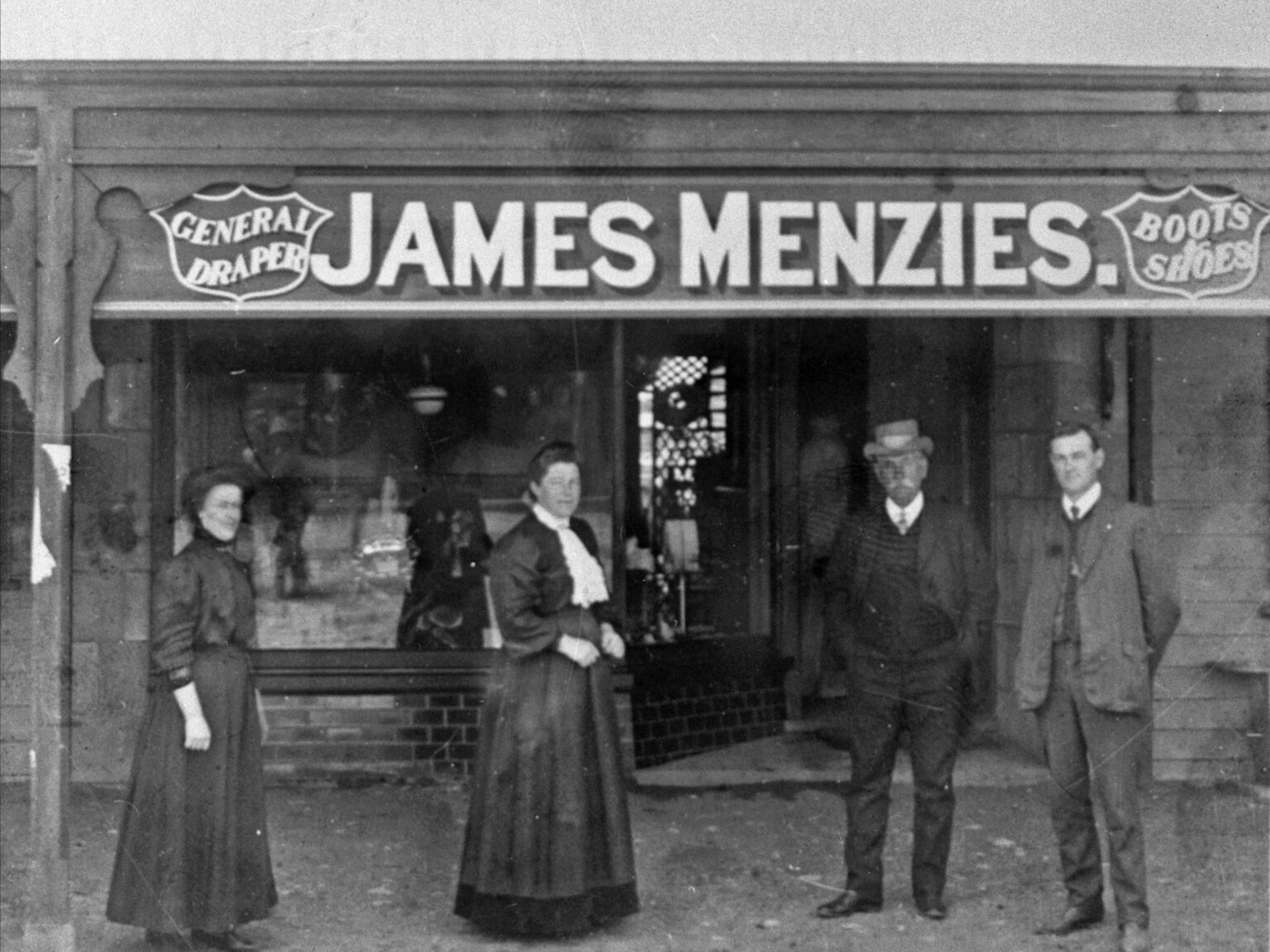 Vintage photo of James Menzies in front of Jeparit Shop