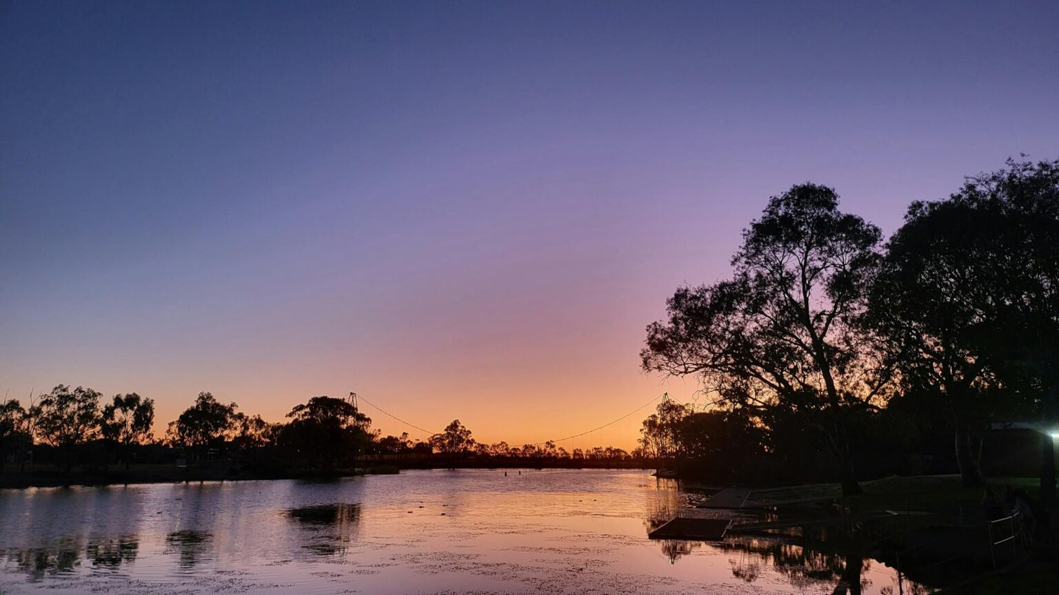 The river at sunset with purple and orange sky