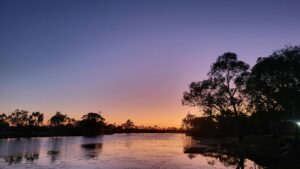 The river at sunset with purple and orange sky