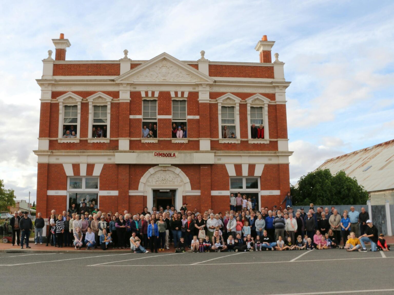 250 Dimboola locals assemble in front of the former National Bank of Australasia building.