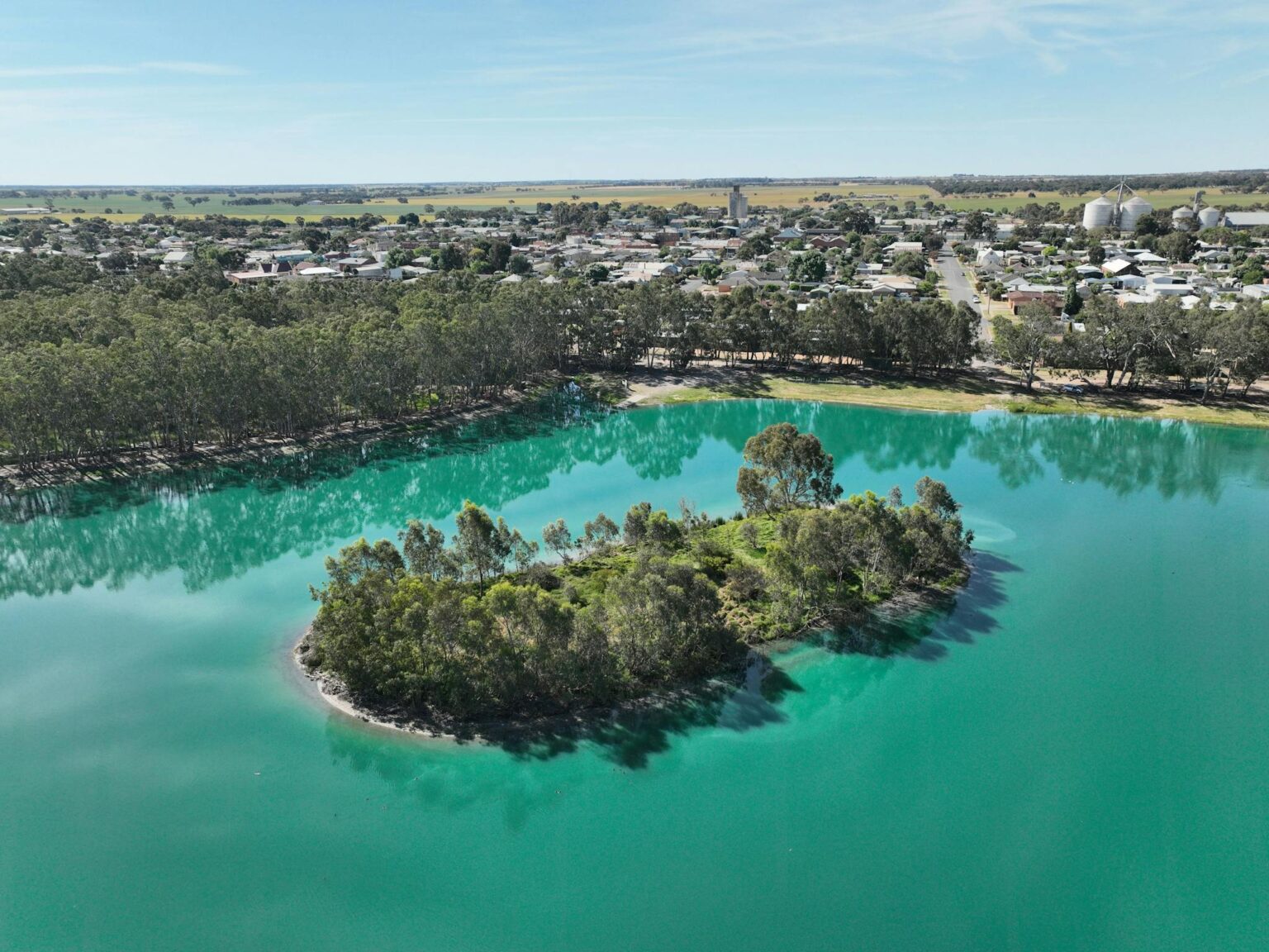 Lake with island and town in background